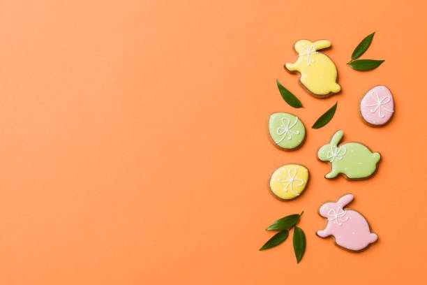 istock holiday preparation Multi colors Easter eggs with cookies on colored background . Pastel color Easter eggs. holiday concept with copy space 1460063934