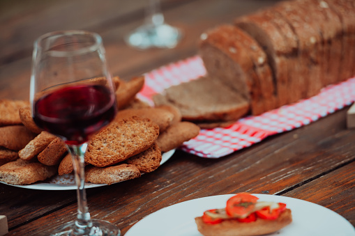composition with a glass of red wine and toasted bread. High quality photo