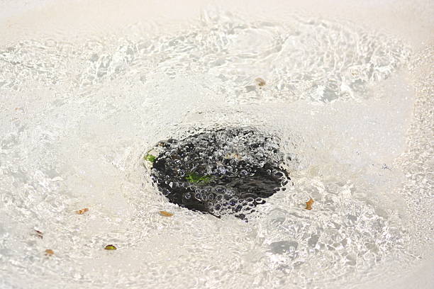 istock detailed bubbles down a fountain drain 146006661