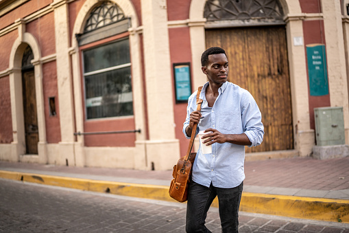 Young businessman walking at the historic district