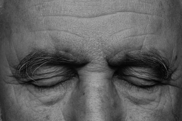 Eye views of an elderly man in black and white.