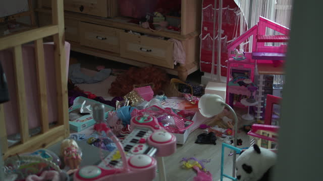 Pink Toy Filled Messy Girl's Room, Little Girl's Room Filled with Pink Toys: Playground or Chaos Area? A girl's nursery with her books and toys cluttered in her room