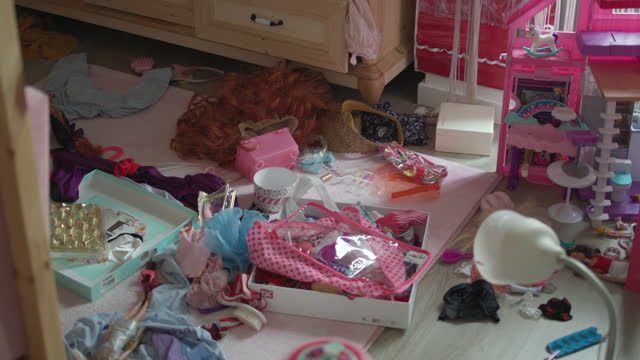 Pink Toy Filled Messy Girl's Room, Little Girl's Room Filled with Pink Toys: Playground or Chaos Area? A girl's nursery with her books and toys cluttered in her room