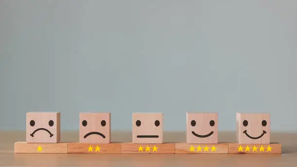 Photo of Mental Health Assessment. feedback rating and positive customer review experience, service and Satisfaction, wood block with 1 to 5 star icon to give satisfaction in service. rating very impressed.