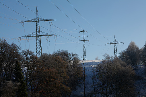 High-voltage pylons, sunset,