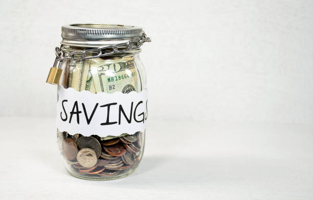 istock Money in Mason Jar with Padlock and Chain 1460079132