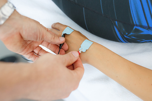 Lectroids Hand Applying Electrodes On Patients Hand For Electrostimulation Stock Photo ...