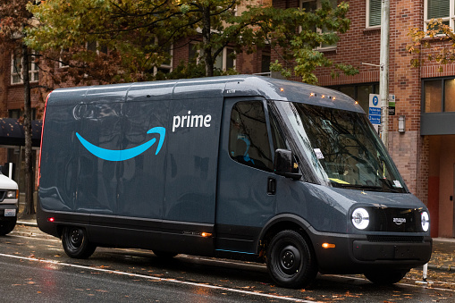 Seattle, USA - Nov 22, 2022: Late in the day a new Amazon prime delivery Rivian van on 4th ave.