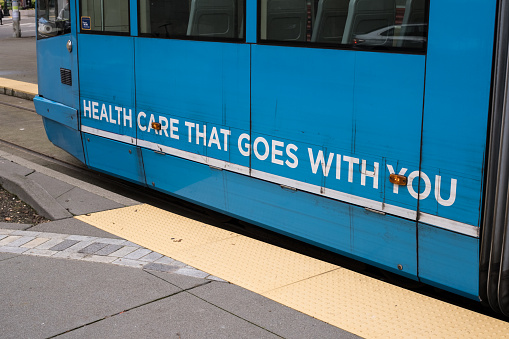 Seattle, USA – Jan 3rd, 2023: Heath care that goes with you written on the south lake union trolley.