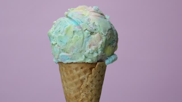 Large rainbow ice cream cone.