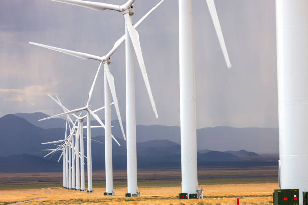 istock Wind turbines generate electricity during a thunderstorm in the central Utah desert. 1460098871