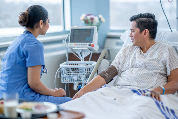 istock Nurse Checking a Patients Vitals 1460099855