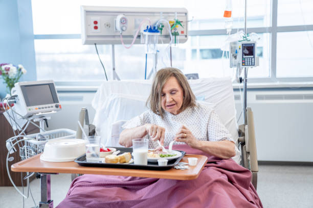 istock Senior Eating Dinner in the Hospital 1460099930