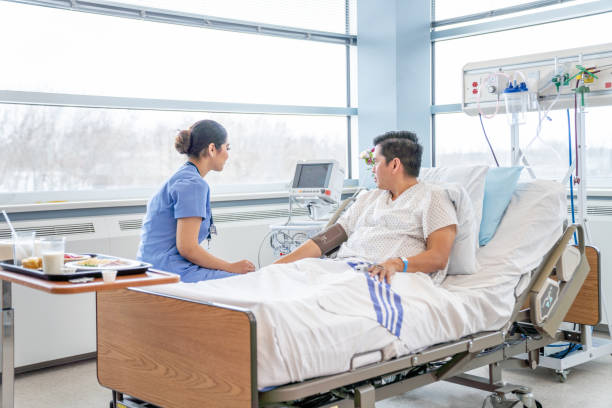 istock Nurse Checking a Patients Vitals 1460099973