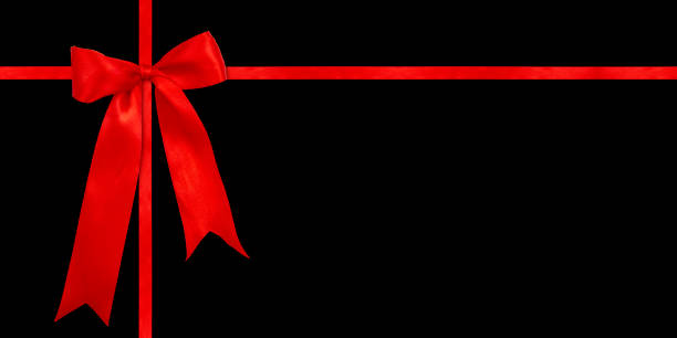 istock Gift wrapping design with red satin bow isolated on black background. Preparation for the holiday. 1460104812