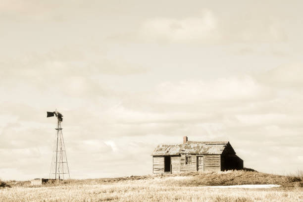 Abandoned farm house and windmill