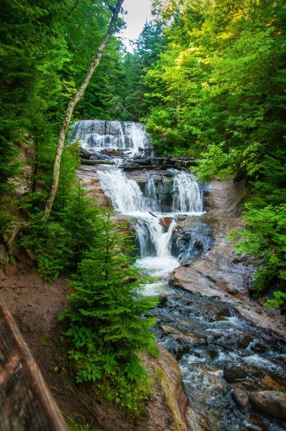 istock beautiful Sable Falls in Northern Michigan Forest 1460109589