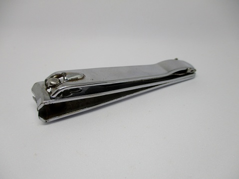 A photo of a nail clipper against a white background