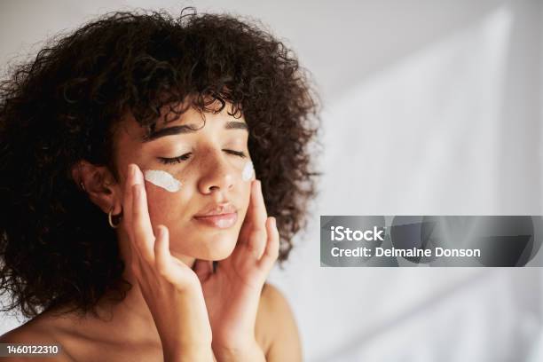 Cream Moisturizer And Facial Black Woman In Skincare Beauty Or Cosmetics Promotion On White Wall Background Face Calm And Gen Z People Or Model Lotion Suncream Or Moisturizer For Skin Care Stock Photo - Download Image Now