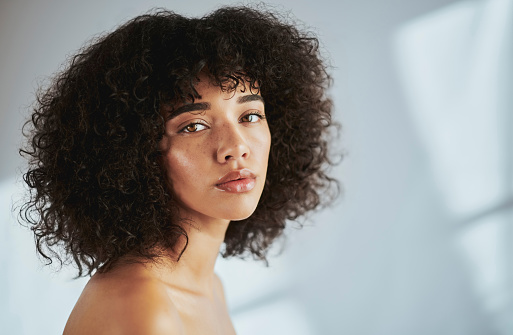 Portrait, beauty and mockup with a black woman in studio to promote natural skincare or treatment. Facial, skin and aesthetic with an attractive young female model inside to for health or wellness