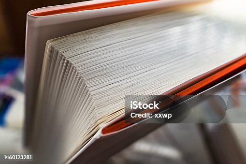 istock Side view of a thick book, macro 1460123281