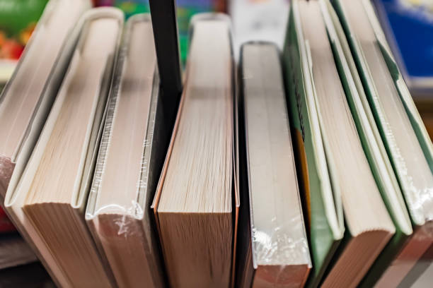 istock Side view of a row of books, macro 1460123287