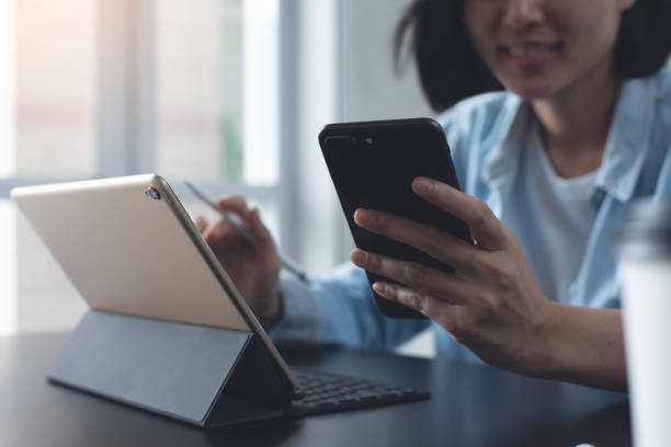 istock Business woman working on digital tablet, laptop computer 1460125108