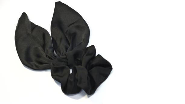 istock Bunny ears scrunchie hair tie satin material isolated white background. selective focus. 1460128549