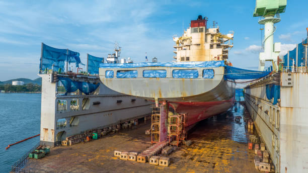 istock cargo container ship at dry dock concept maintenance service working in the sea. Insurance and Maintenance Cargo Ship concept. Freight Forwarding Service maintenance Insurance 1460129533