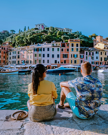 a couple visit Portofino Italy, Portofino famous village bay, Italy Europe colorful village Ligurian coast