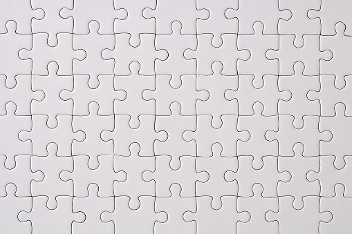 Blank jigsaw puzzles piece isolated on white background