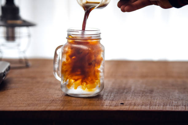 istock Iced coffee is pouring into the glass. 1460140714