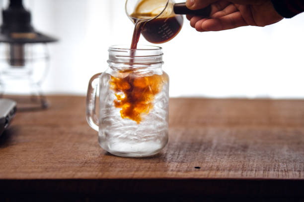 istock Iced coffee is pouring into the glass. 1460141278