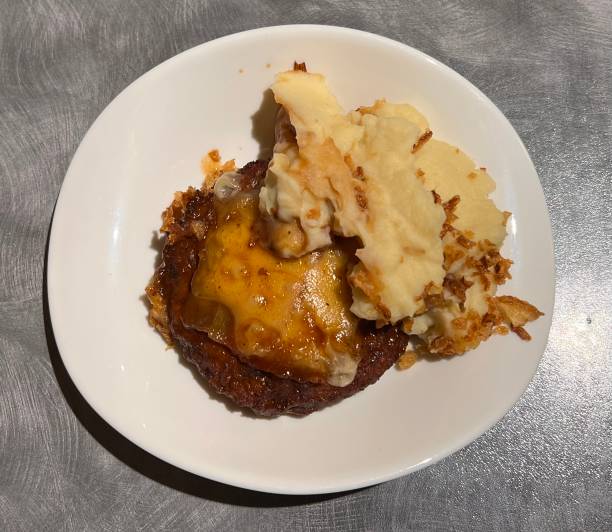 istock minced meat burger with smashed potatoes fried onions gravy cheese 1460147294