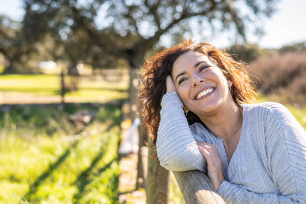 istock Beautiful Woman Smiling At Sunset 1460151482