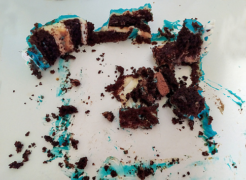 Leftover crumbs from the cake on the package. Top view.