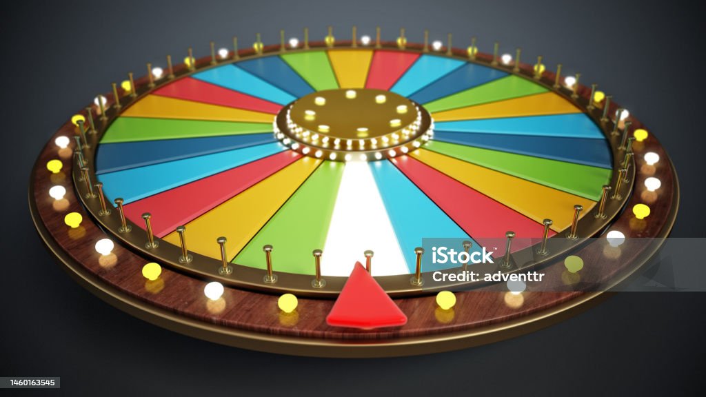 Multi-colored prize wheel with depth of field effect Multi-colored prize wheel with depth of field effect. Wheel Of Fortune Stock Photo