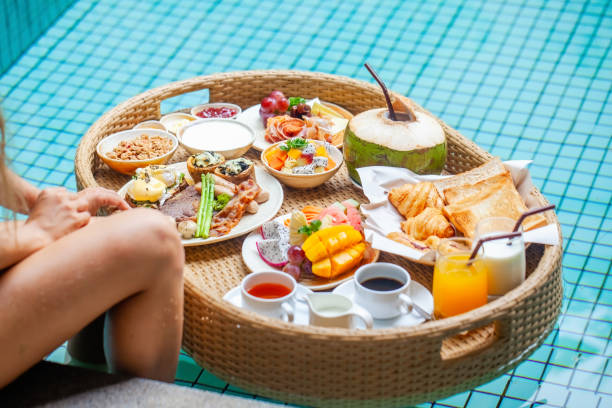 istock Floating breakfast tray in luxury poolside hotel 1460167404