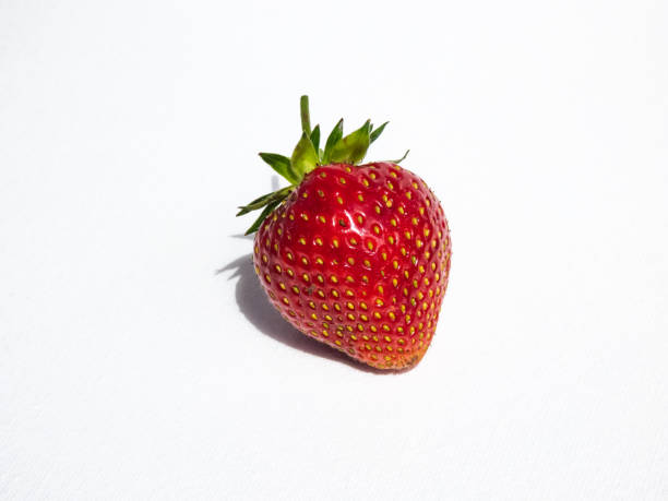 istock Fresh and ripe strawberry on a white, isolated background 1460170144