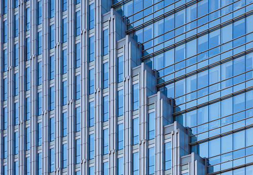 Glass business office buildings architecture in modern city. Urban corporate skyscraper exterior and skyline. Copy space