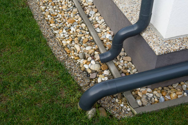 istock Gutter elbow leads rainwater into the garden. Drainage system. 1460173912