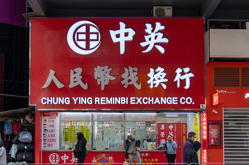 Hong Kong - January 27, 2023 : People at the RMB Exchange Shop in Causeway Bay, Hong Kong.