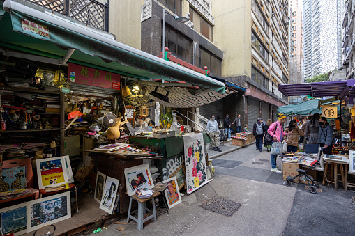 Hong Kong - January 27, 2023 : People at the Upper Lascar Row in Sheung Wan, Hong Kong. Upper Lascar Row is the seemingly endless row of antique stores, offering an eclectic collection of Chinese calligraphy, arts and vintage furniture.