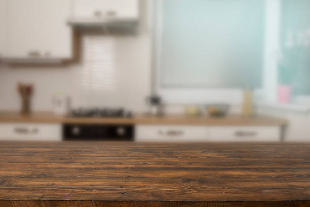 istock Wooden counter top on kitchen blur background 1460175581