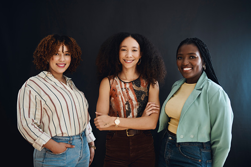 Portrait, friends or women in studio happy and smiling against a black background. Style, fashion and group of African American people feeling positive and confident together