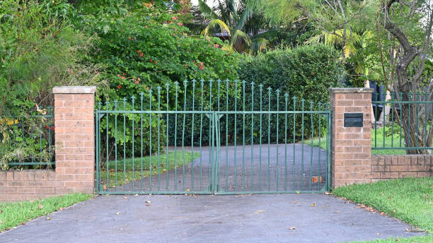 istock Metal entrance gate across a drive way 1460177836