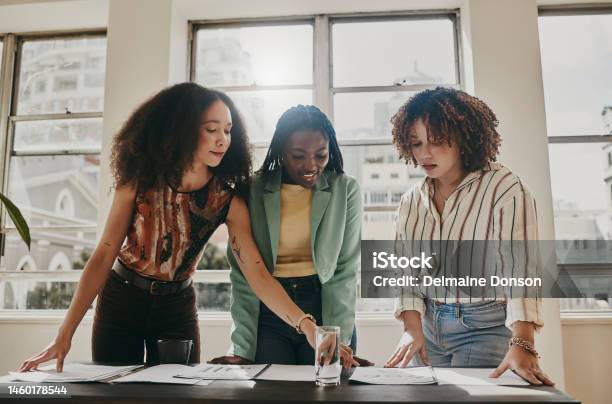 Teamwork Planning And Management Black Woman With Documents Paperwork Or Design Strategy In Office Business Startup Gender Equality And Marketing Ideas Of Diversity People In Meeting Planning Stock Photo - Download Image Now