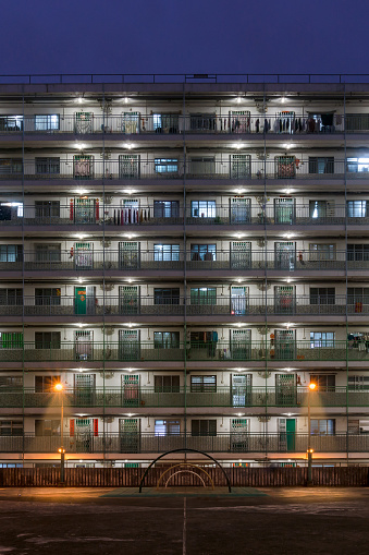 Night view of Aged Public Rental Housing Estate in Shek Kip Mei in Hong Kong with climbing frame at playground
