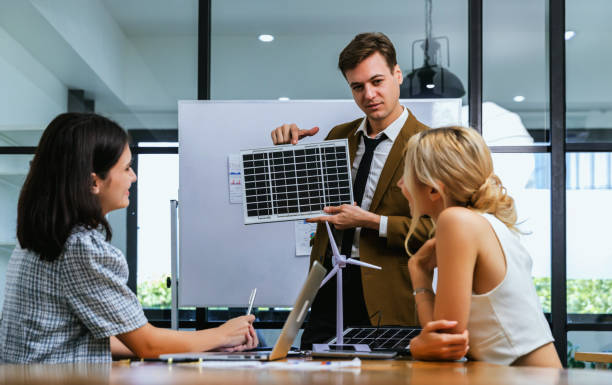 istock Business person meeting on solar cell panel technology. Business People Discussing Solar Power Environment Concept 1460185603