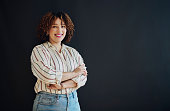 Studio portrait of happy black woman with vision, smile and product placement at small business launch. Confidence, marketing and advertising news space, woman at startup isolated on dark background.